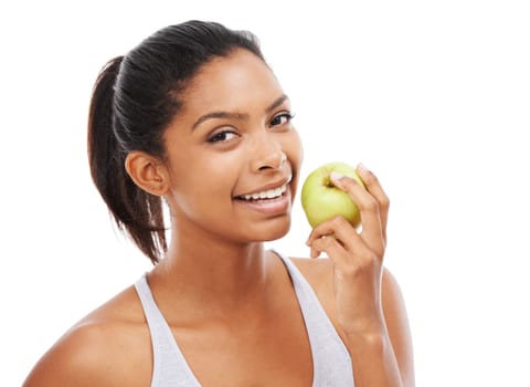 Enjoying a healthy snack. A gorgeous young woman in sportswear eating an apple.