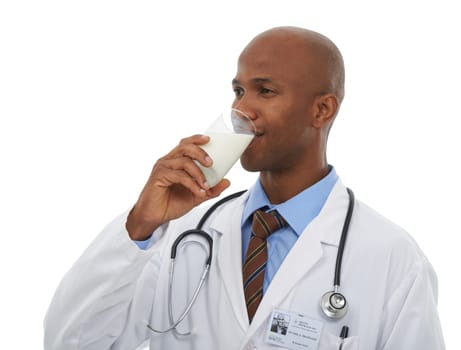 Recommended by a healthcare professional. A handsome doctor holding a glass of milk.