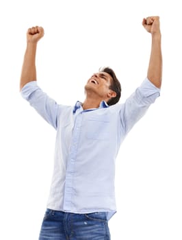 Feeling victorious. A handsome young man standing with his arms raised in a gesture of victory isolated on white.