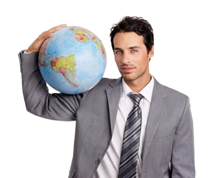 The world is mine to conquer. A handsome young executive holding a globe while isolated on a white background.