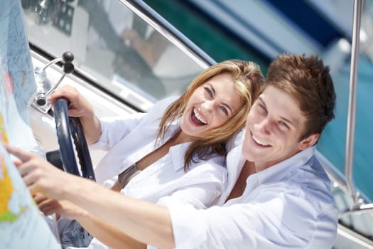 Yacht, happy and couple sailing on a boat together on luxury holiday or vacation with happiness on a date. Portrait, wealth and young rich man in a relationship with woman travel and bonding for love