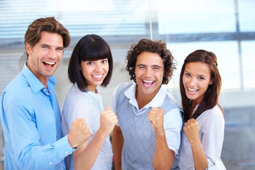 Business people, portrait smile and fist in celebration for winning, teamwork or success at the office. Happy and excited employees standing together in happiness for victory, win or team promotion
