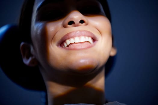 Dental work done right leaves a smile thats super bright. a young woman having a dental procedure performed on her.