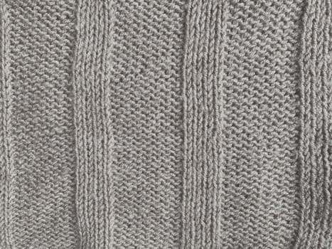 Handmade knit material with detail weave threads.