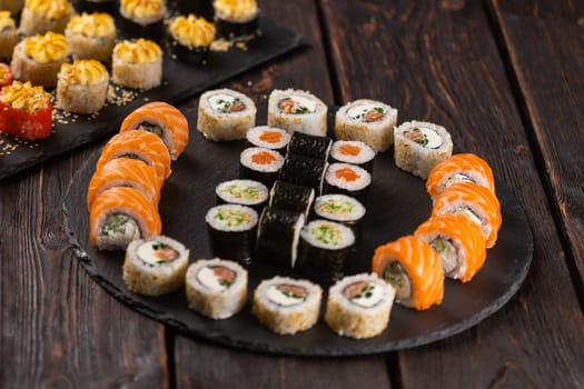 Rolls set with fish shrimp and caviar sushi close-up - asian food and japanese cuisine concept