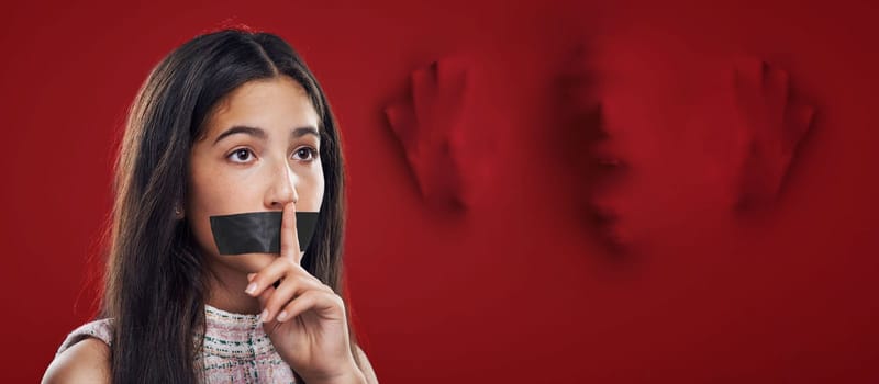 Woman silence, face tape and victim of domestic violence, sexual assault trauma or abuse crime from human trafficking. Red secret mockup, censored speech and young girl scared, fear or quiet gesture