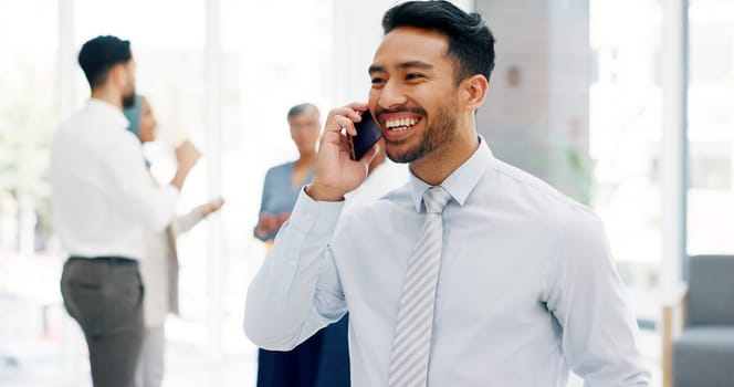 Businessman, communication and phone call with mobile networking at financial advisory startup company. Conversation, b2b and business man consulting on smartphone, talking and standing in office.