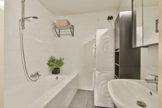 a white bathroom with a white toilet and a tub