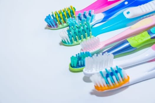 whitening. tooth care. teeth healthy concept. New ultra soft toothbrushes in a row, Dental Industry. various types of toothbrushes. beautiful smile concept.