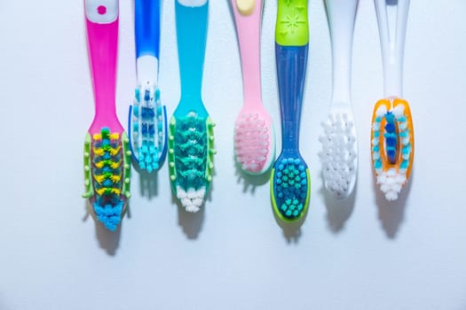 whitening. tooth care. teeth healthy concept. New ultra soft toothbrushes in a row, Dental Industry. various types of toothbrushes. beautiful smile concept.
