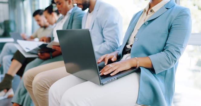 Hands, laptop or waiting and a business woman in line for her hiring interview with human resources. Computer, resume and recruitment with a female candidate sitting in a row for a company vacancy