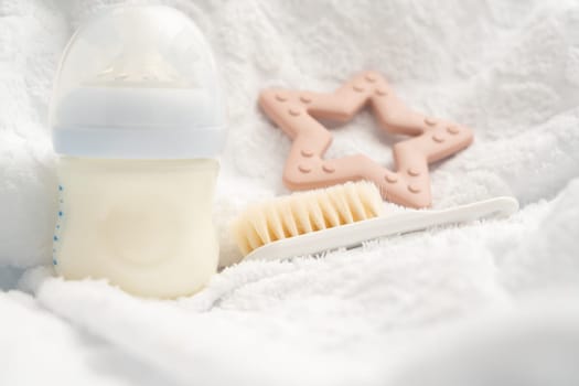 Accessories for a newborn, milk bottle toy and soft brush