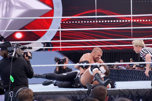 Legendary Battle: Triple H and Sting Lock Horns in the Ring