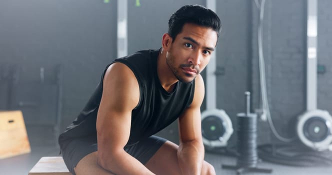 Portrait of man, fitness and healthy gym sports muscle training athlete. Young calm Asian male, wellness exercise workout motivation and bodybuilder vision relax in lifestyle health club studio