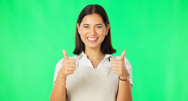 Happy woman, hands and thumbs up on green screen for good job, agreement or winning against a studio background. Portrait of female smile showing thumb emoji, yes sign or like for winning on mockup