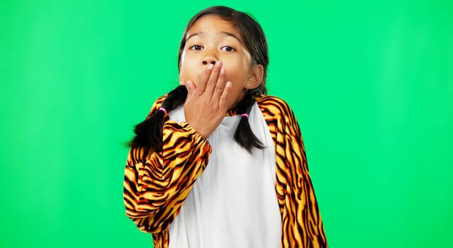 Face, green screen and girl in tiger costume, surprise and hand on mouth on a studio background. Portrait, female child and young person with shock, excitement and happiness with adorable kid and wow