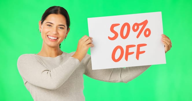 Woman, face and discount sign on green screen, smile and advertising with poster, store promotion and sale. Portrait, billboard and cardboard with text, happy female with notice on studio background