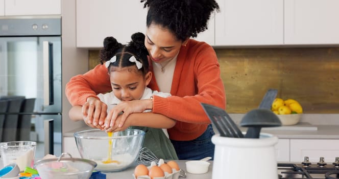 Mother, child and baking with eggs in the kitchen for family bonding, learning and fun with ingredients at home. Happy mom teaching helpful kid to bake, cook or mix for recipe together at the house