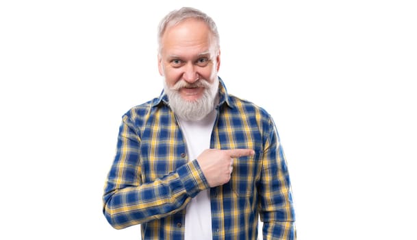handsome 50s elderly gray-haired man with a beard points his finger on a white background