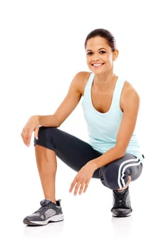 Sporty and ready to exercise. Portrait of a beautiful young woman in gymwear crouched down.