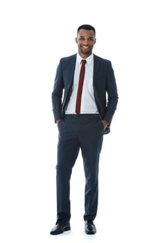 Feeling successful today. A smiling businessman with his hands in his pockets while isolated on white.
