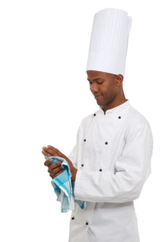 Hes all about hygiene in the kitchen. An african chef cleaning his hands before working with food.