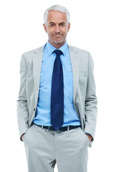 He takes a relaxed approach to business. Portrait of a mature businessman with his hands in his pockets isolated on white.