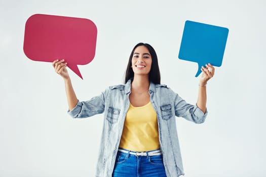 Every opinion matters. Studio shot of an attractive young woman holding speech bubbles.