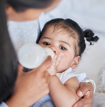 Baby drinking bottle, formula and nutrition with feeding and family, health and growth with early childhood development. Mother feed infant child milk, people at home with health and wellness