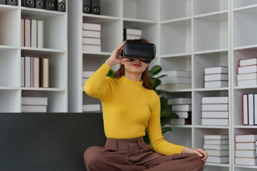 Attractive Asian woman resting comfortable living room and using AR glasses, Relax, Sofa, Lifestyle, Virtual Reality Headset