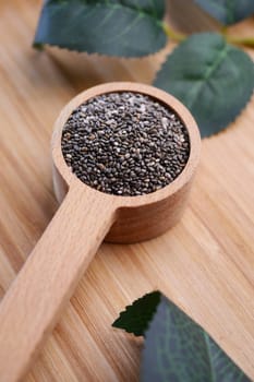 close up of chia seed in wooden spoon