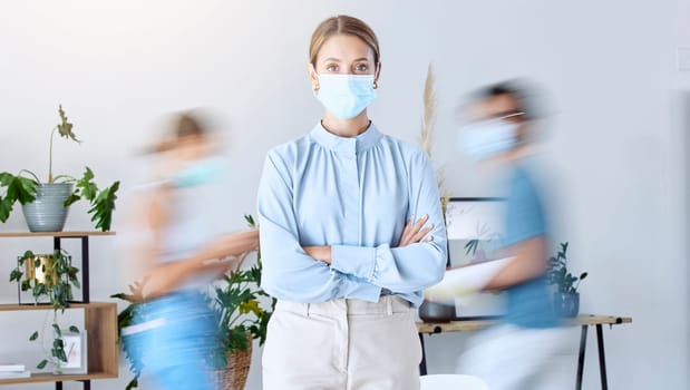 Busy business woman with her arms crossed and covid mask for safety at work in a office. Portrait of female manager with facial cover protection from a virus and covid 19 for healthcare and wellness
