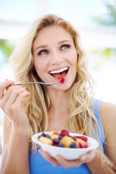 Happy woman, smile and fruit bowl for healthy diet, eating or fiber nutrition outdoors. Female person smiling in happiness or satisfaction for sustainability, organic meal or natural food in nature