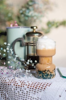 exotic latte with blue tapioca still life with beautiful flowers in the morning