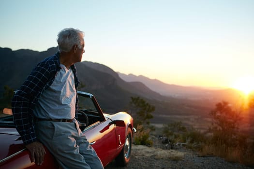 In solitude there is also freedom. a senior man out on a road trip.