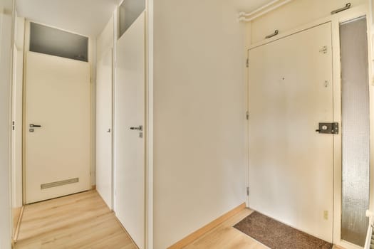 a passageway between two closets with doors