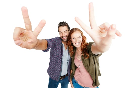 Were all about peace and love. a couple posing against a white background.
