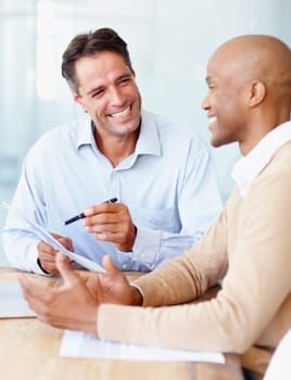 Meeting, happy business men with papers and talking or negotiating in work office together. Interview or contract agreement, teamwork or collaboration and coworkers discussing proposal or promotion