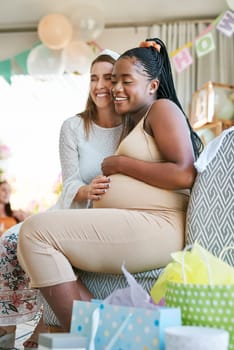 Oh bestie Im so proud of you. two female friends hugging during a baby shower.