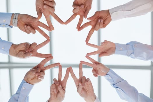 Star, shape and hands of business people with peace, team building motivation and below support.