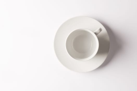 Life begins once Ive had a cuppa. Closeup shot of a cup and saucer against a white background.
