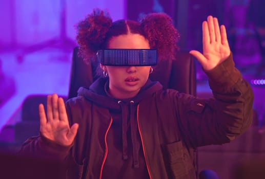Virtual reality glasses, hands and black woman in metaverse for futuristic gaming in purple room. Gamer person with ar tech for 3d, vr and cyber world experience streaming online digital fantasy game