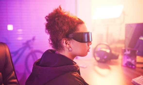 Metaverse, virtual reality glasses and woman gamer for futuristic gaming in purple room. Cyberpunk person with ar tech for 3d, vr and cyber world experience streaming online digital fantasy game