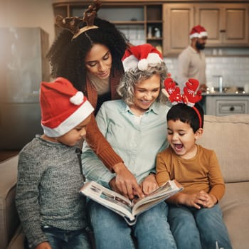 Happy, christmas and family looking at a photo album for memories, nostalgia and bonding. Smile, festive and mother, grandmother and children excited to look at pictures of relatives in a book
