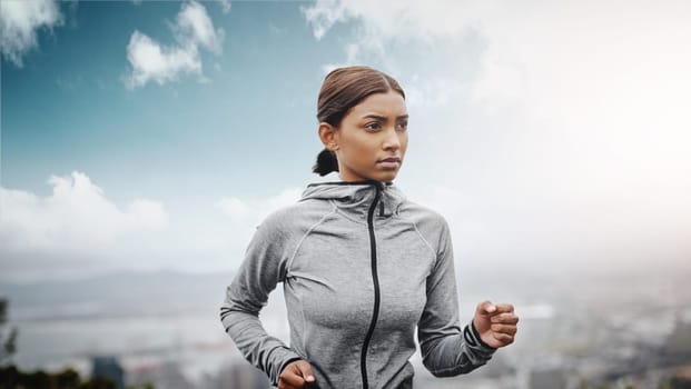 Fitness, runner and Indian woman with exercise, training and focus for wellness, balance and cardio. Female person, lady and athlete outdoor, run and practice for marathon, energy and workout goal