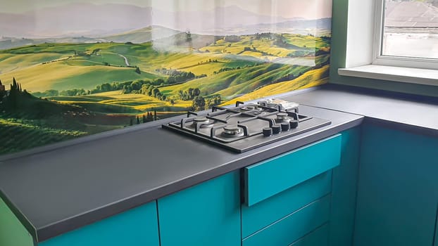 Kitchen interior design. Sink, cooker hood. Petroleum color.