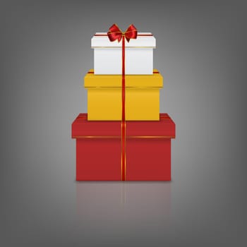 Stack of three realistic gift boxes with red ribbon and bow