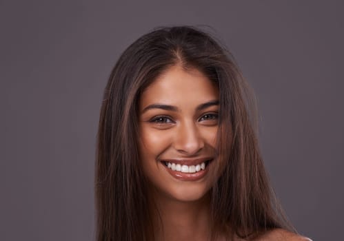 No accessory is better than a gorgeous smile. Portrait of a beautiful young woman posing in the studio.