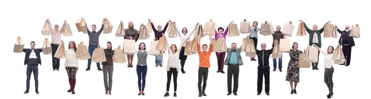 a group of people are running paper shopping bags