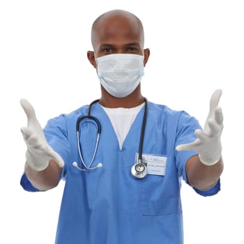 Protected against germs. An african surgeon wearing his surgical gloves and scrubs.